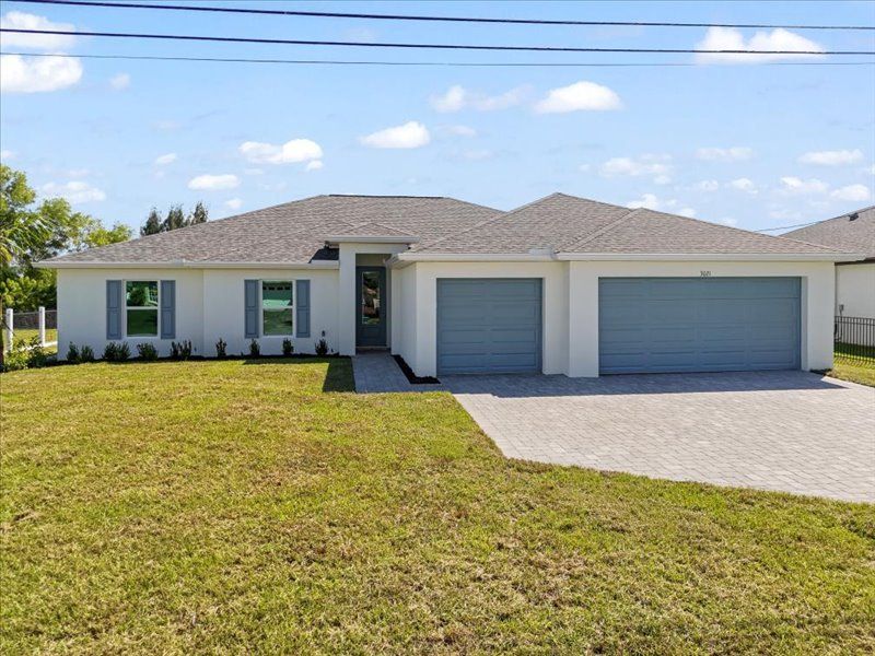 Representative exterior photo of a completed home built from the The Paradise Cove II by Sunlife Homes LLC in Cape Coral, Cape Coral, FL (Image 1).