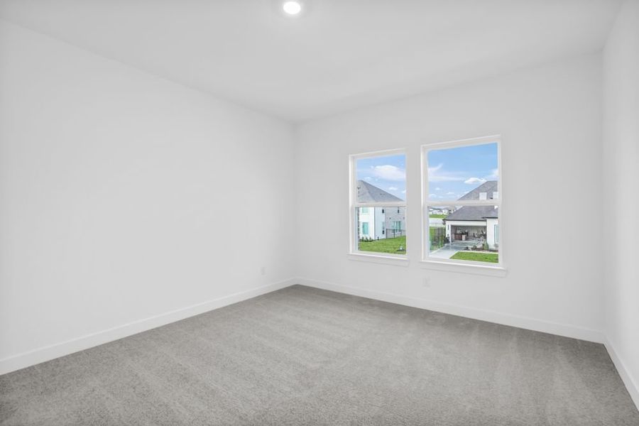 Spacious, unfurnished interior of a new home in Avalon at Friendswood 70s, Friendswood (Image 30).