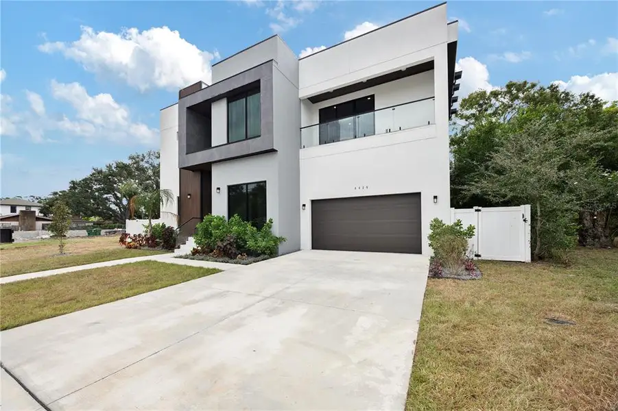 Front exterior of a new home in , Tampa, FL, highlighting curb appeal (Image 1).