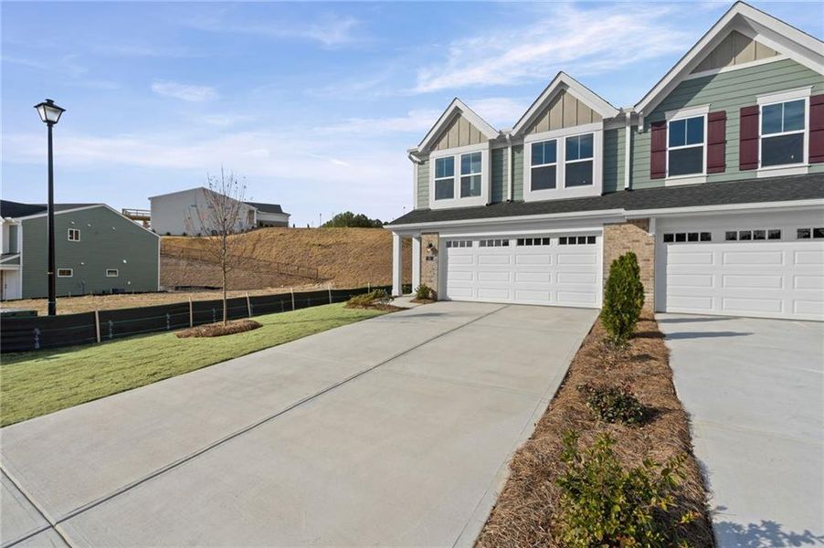 Front exterior of a new home in Villas at Gold Creek, Dawsonville, GA, highlighting curb appeal (Image 23).