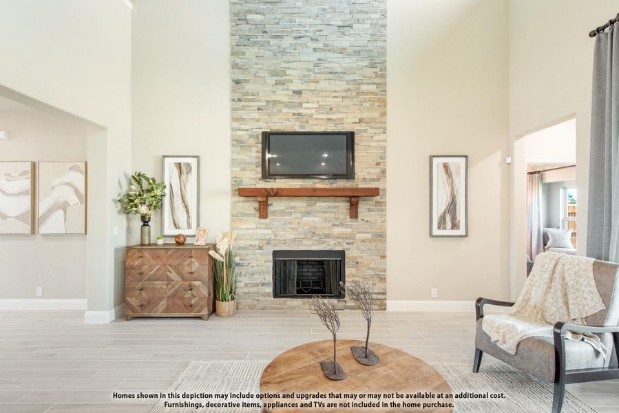 Living room with floor-to-ceiling stacked stone fireplace, wood mantel, and high ceilings Living room with floor-to-ceiling stacked stone fireplace, wood mantel, and high ceilings