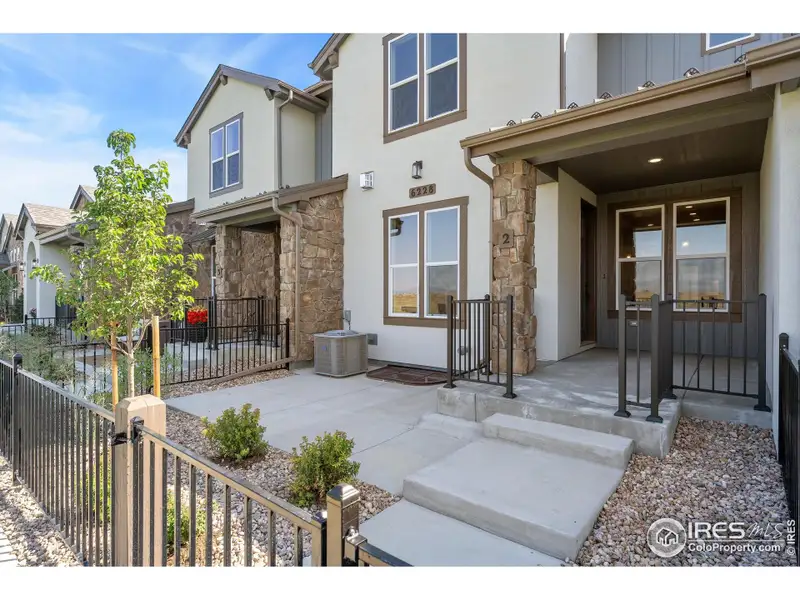 Enjoy your own gated courtyard and covered porch