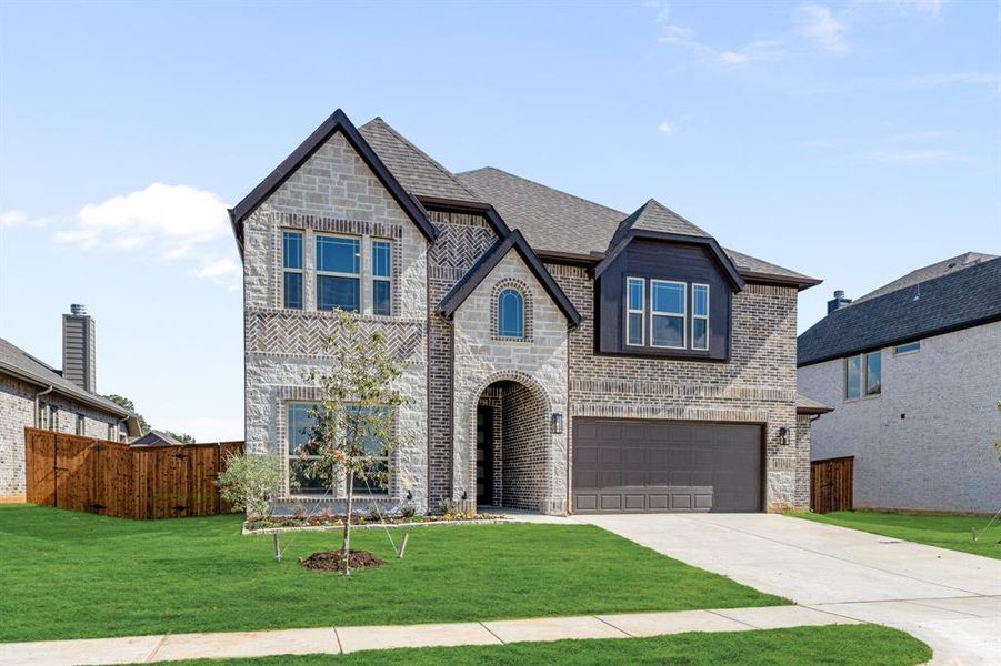 Front exterior of a new home in Mockingbird Hills 60-65, Joshua, TX, highlighting curb appeal (Image 1).