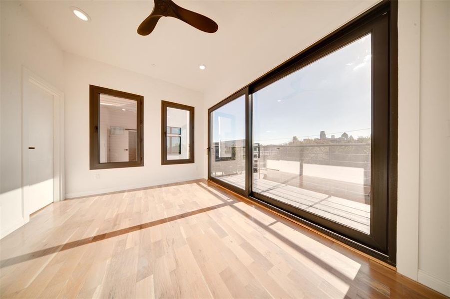 Empty room featuring light hardwood / wood-style floors and ceiling fan