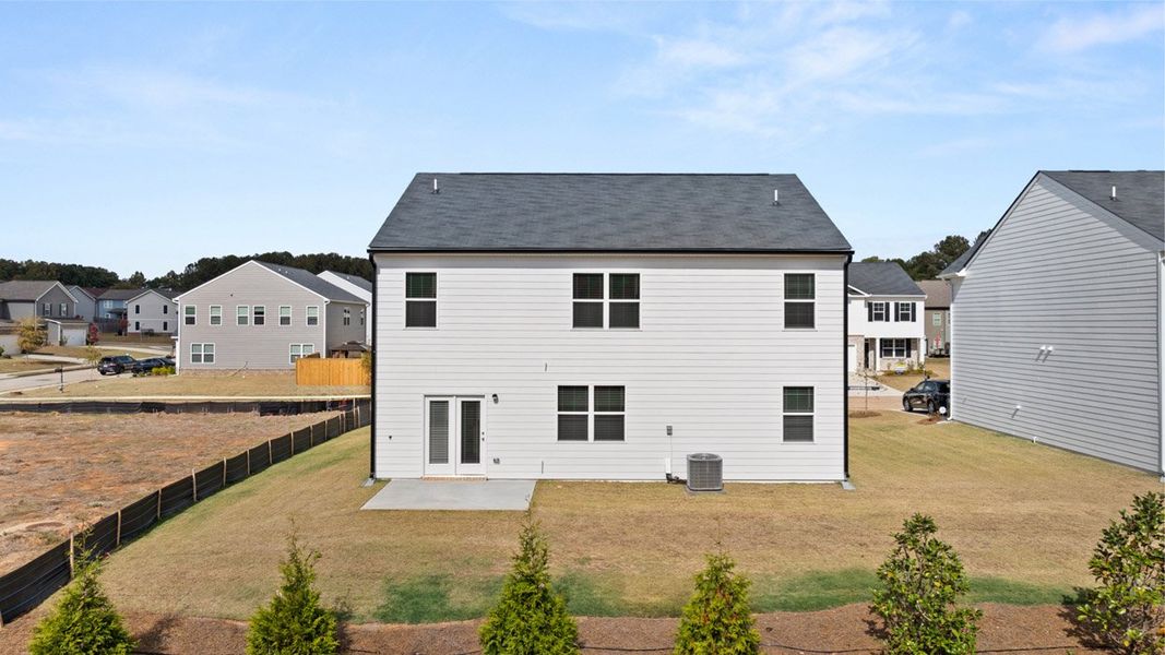 Front exterior of a new home in Locust Grove Station - Cedar Ridge, Locust Grove, GA, highlighting curb appeal (Image 20).