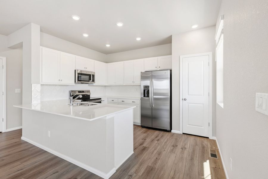 Furnished interior view inside a new home in Windler, Aurora (Image 4).