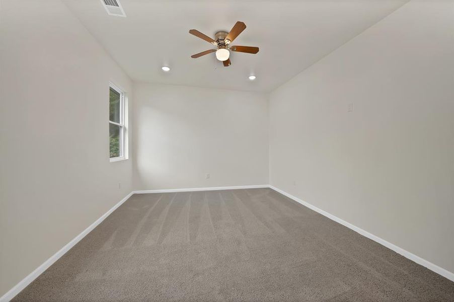 Unfurnished room featuring ceiling fan, carpet floors, and recessed lighting