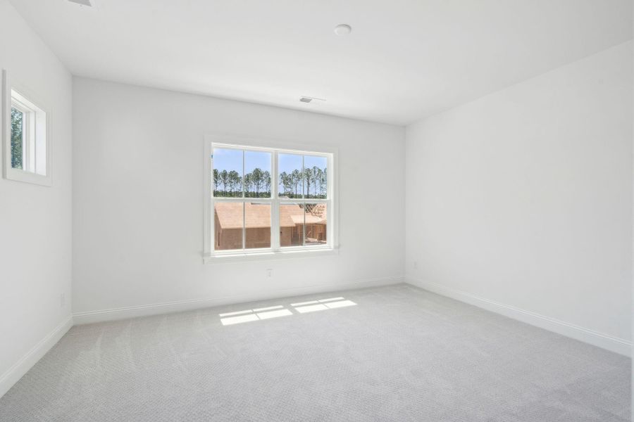 Spacious, unfurnished interior of a new home in The Domus Collection at Midtown Nexton, Summerville (Image 32).