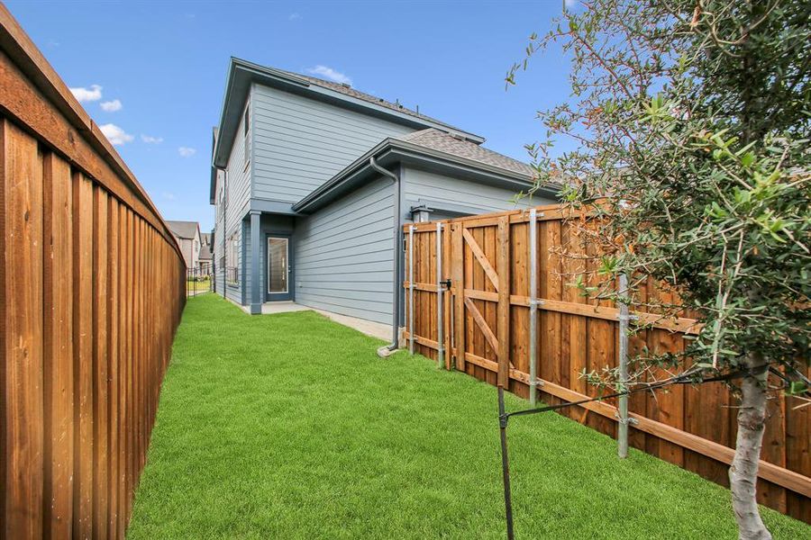 Exterior details and patio area of a home in Karis - Cottage Series, Crowley (Image 3).