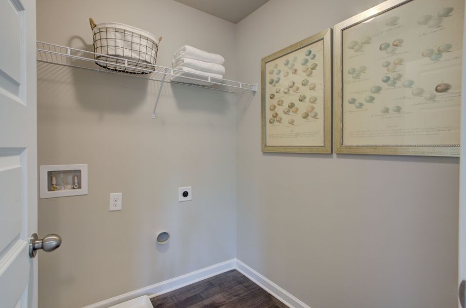 Upstairs laundry room located off hallway