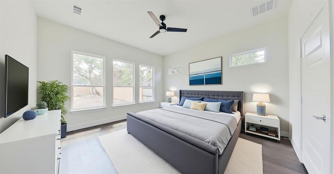 Bedroom featuring wood finished floors and a ceiling fan