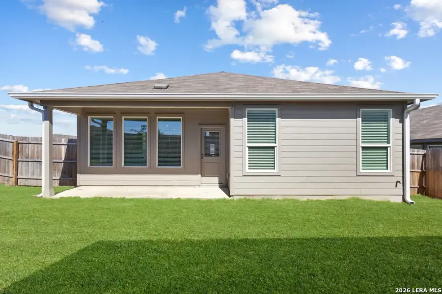 Exterior details and patio area of a home in Hightop Ridge, Converse (Image 35).