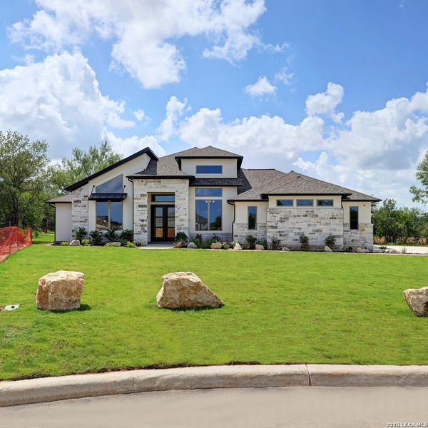 Front exterior of a new home in Megan's Landing, Castroville, TX, highlighting curb appeal (Image 28).