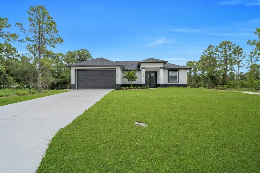 Front exterior of a new home in , Lehigh Acres, FL, highlighting curb appeal (Image 19). Front exterior of a new home in , Lehigh Acres, FL, highlighting curb appeal (Image 19).