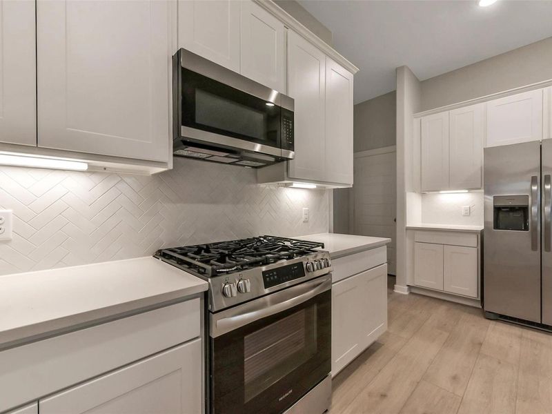 Furnished interior view inside a new home in Sunterra, Katy (Image 13).