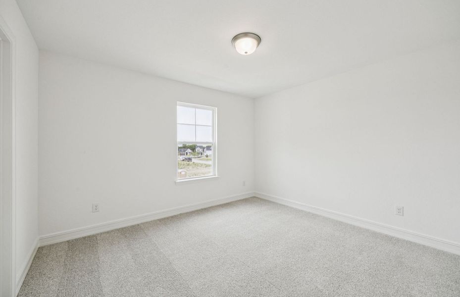 Secondary bedroom designed with generous storage solutions  *Real home pictured