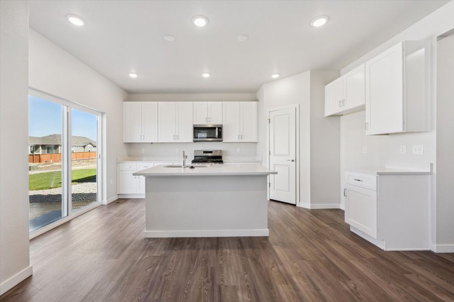A kitchen with white cabinets. A kitchen with white cabinets.