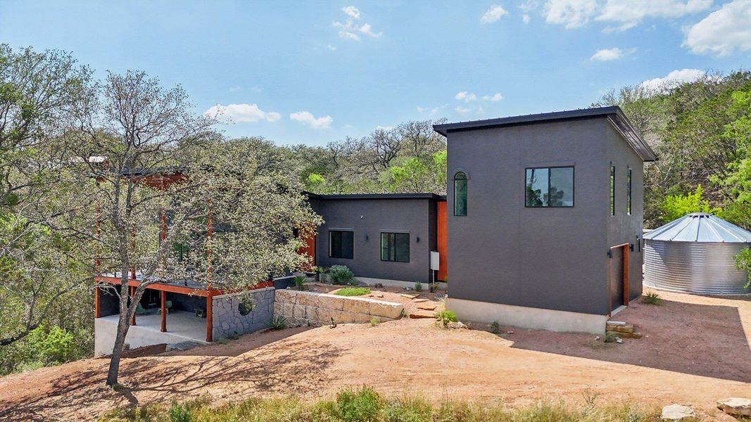 Rear view of property featuring stucco siding and a patio area Rear view of property featuring stucco siding and a patio area