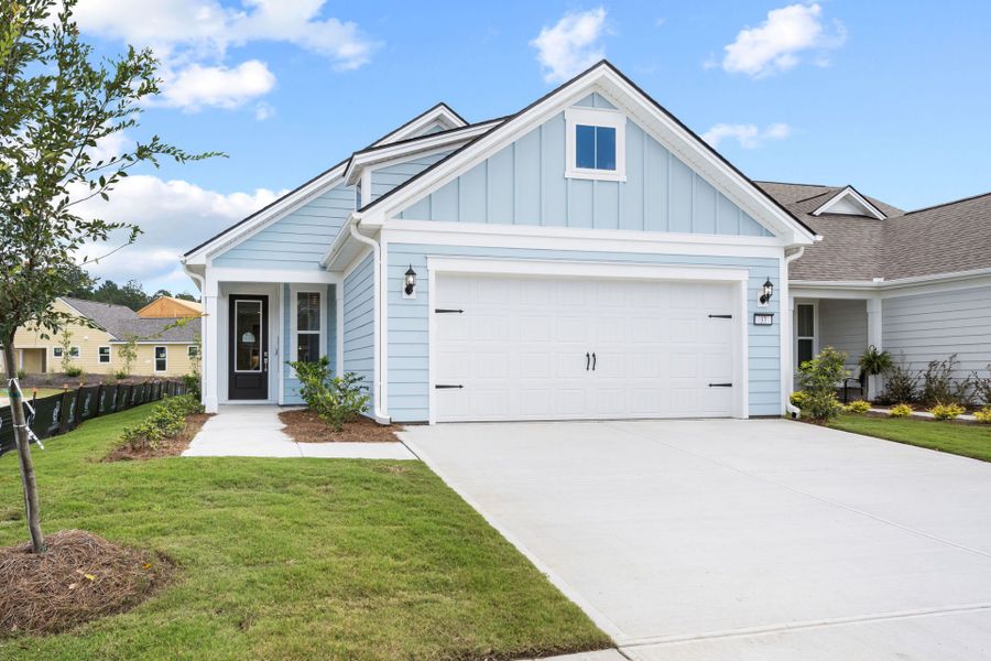 Front exterior of a new home in Del Webb Savannah at Heartwood, Richmond Hill, GA, highlighting curb appeal (Image 28). Front exterior of a new home in Del Webb Savannah at Heartwood, Richmond Hill, GA, highlighting curb appeal (Image 28).