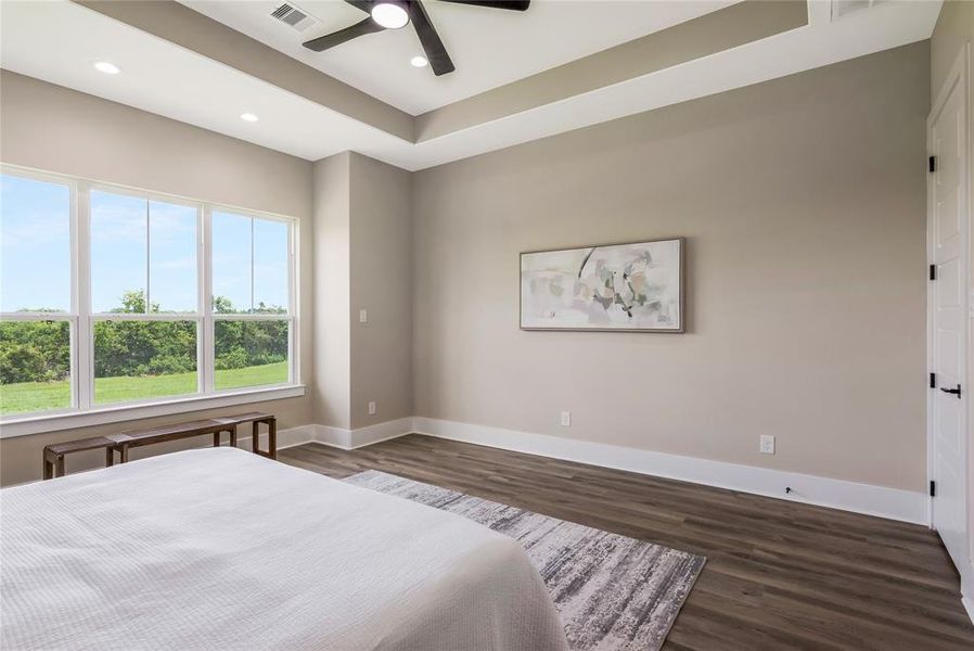 Primary bedroom with tray ceiling Primary bedroom with tray ceiling