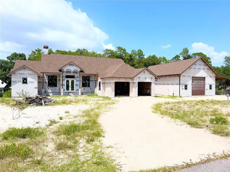 Front exterior of a new home in , New Port Richey, FL, highlighting curb appeal (Image 2). Front exterior of a new home in , New Port Richey, FL, highlighting curb appeal (Image 2).