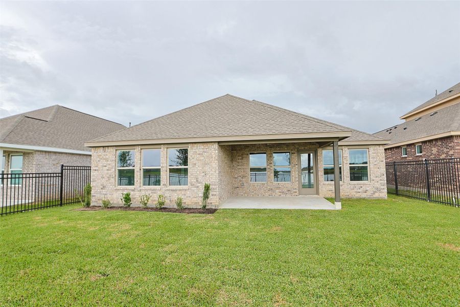 Exterior details and patio area of a home in Sunterra, Katy (Image 3). Exterior details and patio area of a home in Sunterra, Katy (Image 3).