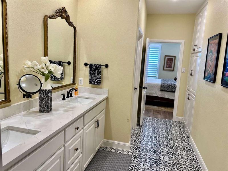 Bathroom with vanity and tile patterned flooring