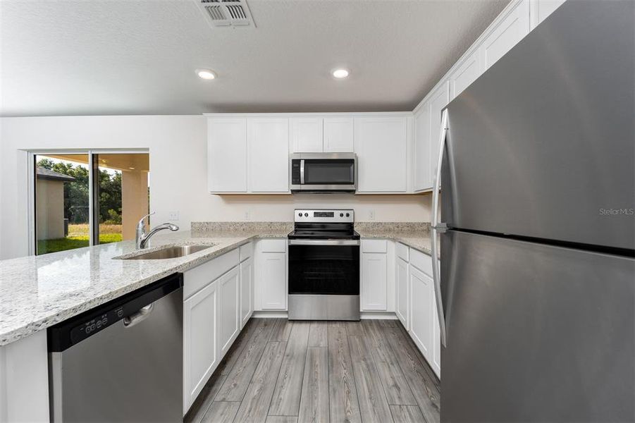 Furnished interior view inside a new home in Gum Lake Preserve, Lake Alfred (Image 7).