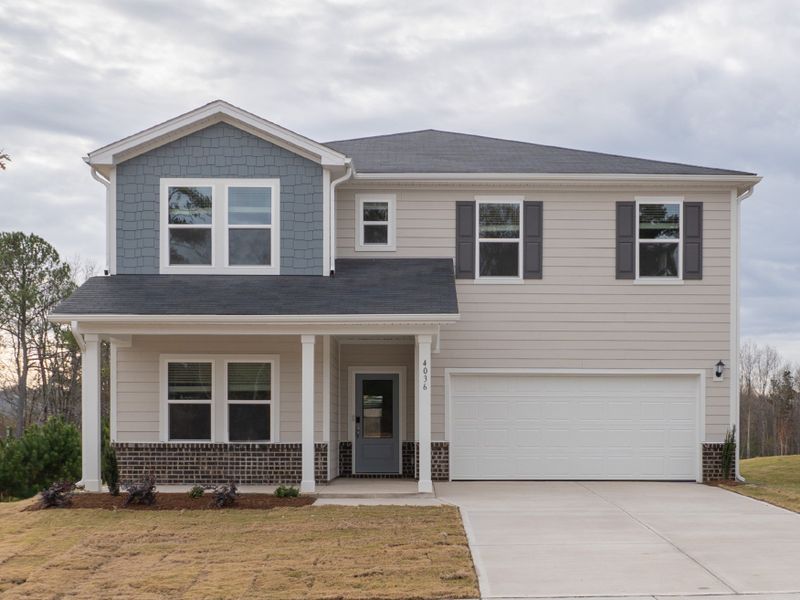 Front exterior of a new home in Watkins Glen, Raleigh, NC, highlighting curb appeal (Image 1). Front exterior of a new home in Watkins Glen, Raleigh, NC, highlighting curb appeal (Image 1).