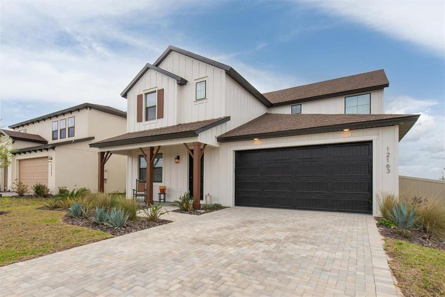 Front exterior of a new home in Hilltop Point, Dade City, FL, highlighting curb appeal (Image 24).
