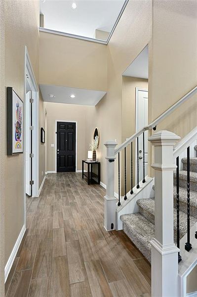 Foyer with lovely ceilings and a don't forget to visit the garage and laundry room.