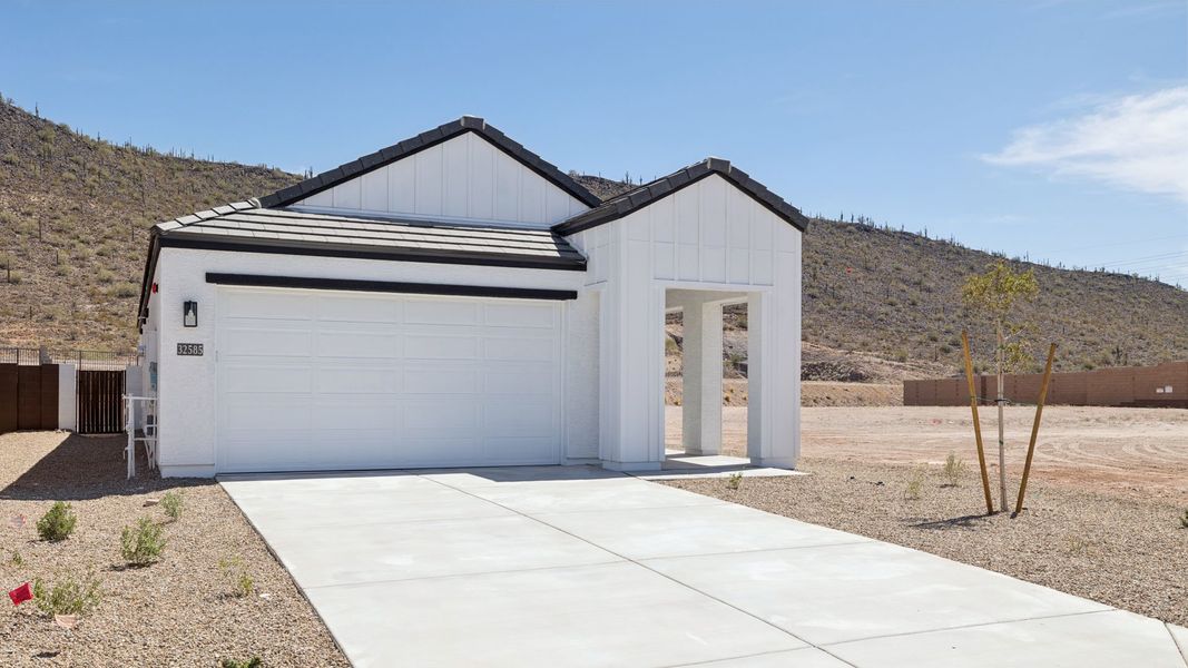 Front exterior of a new home in The Buttes at Mystic, Peoria, AZ, highlighting curb appeal (Image 2).