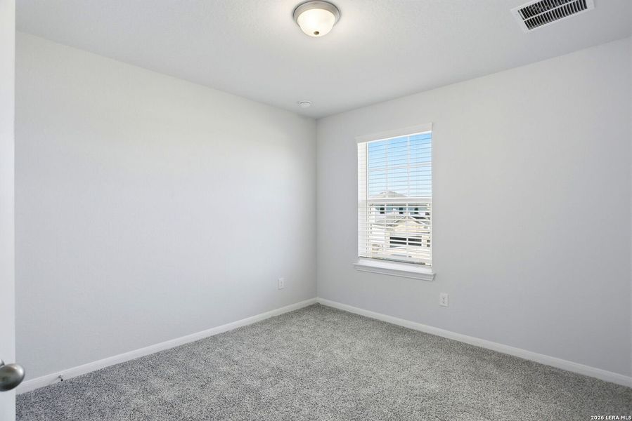 Spacious, unfurnished interior of a new home in Hunter's Ranch, San Antonio (Image 23).