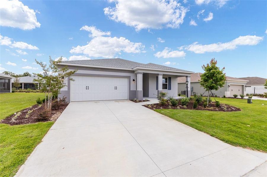 Front exterior of a new home in , Ocala, FL, highlighting curb appeal (Image 19).