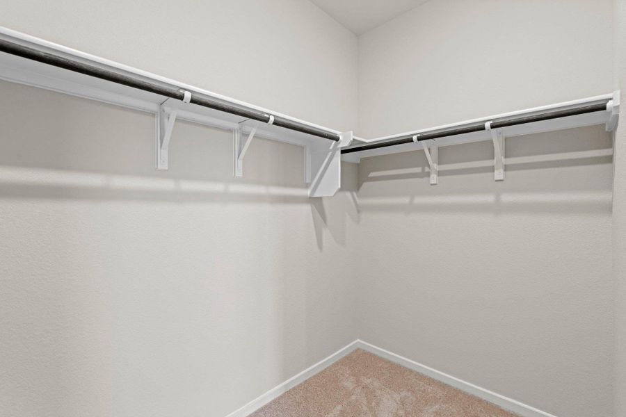 Walk-in closet in Primary Bedroom Walk-in closet in Primary Bedroom