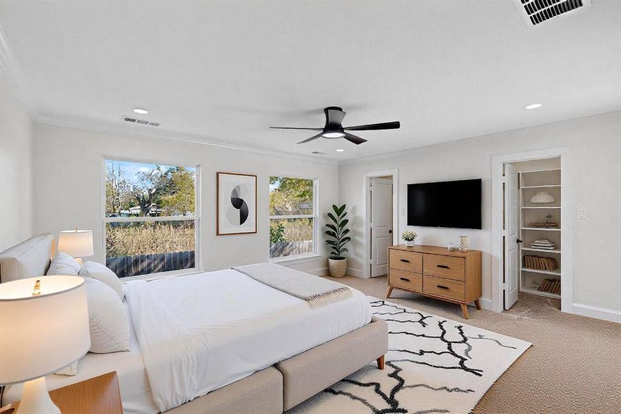 Bedroom featuring light carpet, ceiling fan, crown molding, and recessed lighting