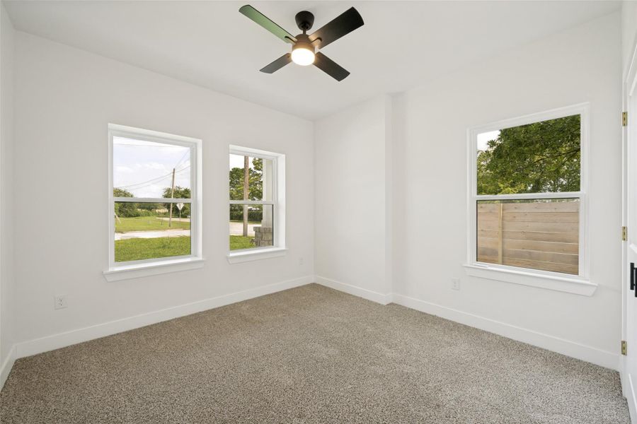 A well-lit room offering a comfortable and serene ambiance with practical overhead lighting. A well-lit room offering a comfortable and serene ambiance with practical overhead lighting.