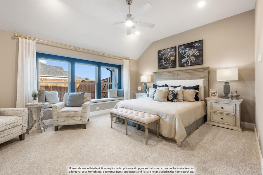 Master bedroom with vaulted ceiling, ceiling fan, carpet flooring, and large window with seating area Master bedroom with vaulted ceiling, ceiling fan, carpet flooring, and large window with seating area