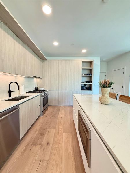 Streamlined design and luminous surfaces define this contemporary kitchen.