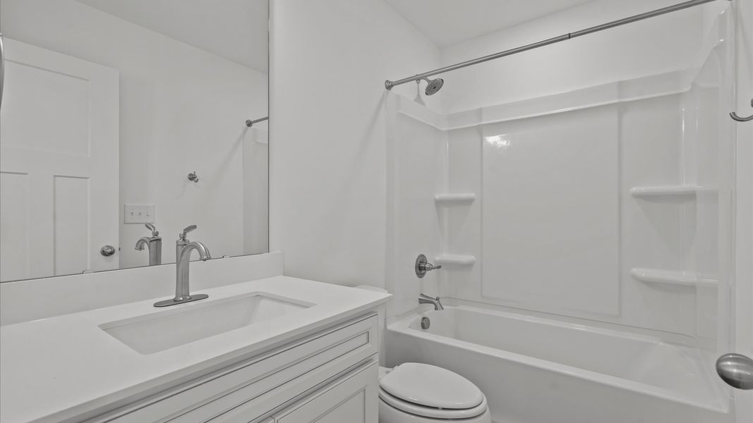 Superior bath with clean lines, contemporary lighting, and timeless style