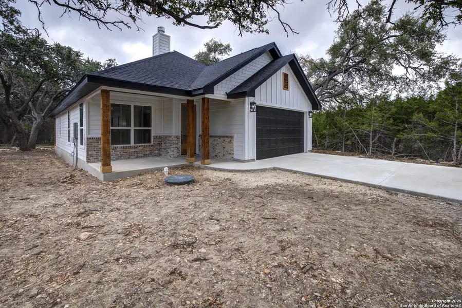 Front exterior of a new home in , Wimberley, TX, highlighting curb appeal (Image 2).