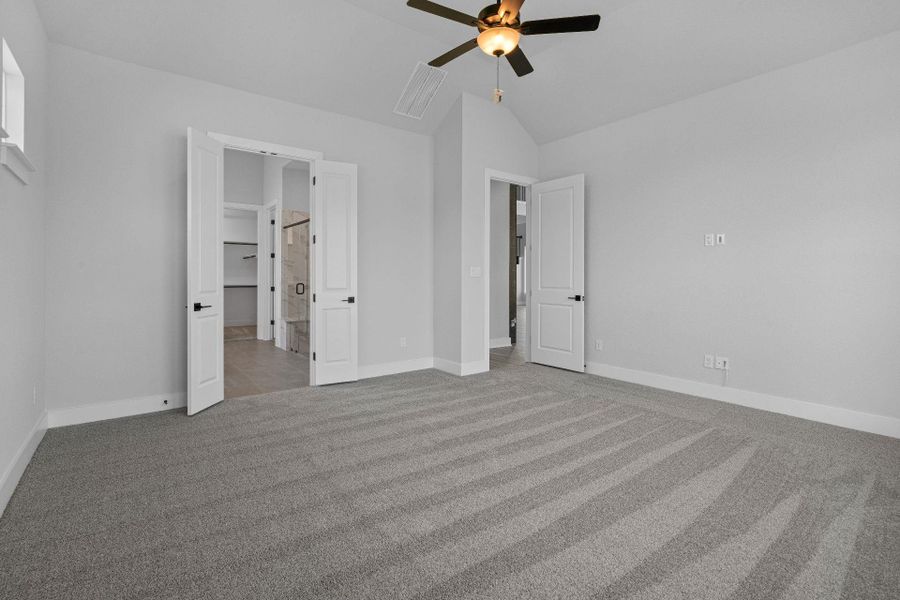 Primary Bedroom with elevated ceiling