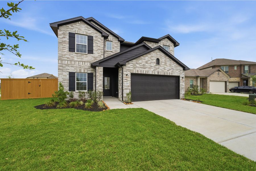 Front exterior of a new home in Lago Mar, Texas City, TX, highlighting curb appeal (Image 2).
