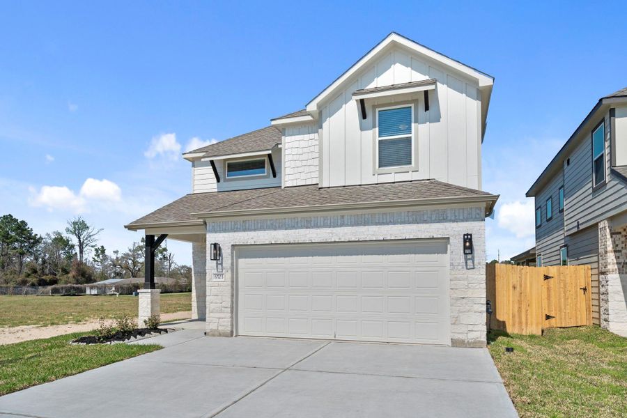 Front exterior of a new home in Cypresswood Landing, Humble, TX, highlighting curb appeal (Image 19).