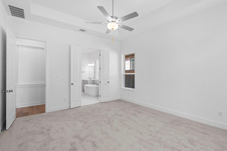 Primary Bedroom with tray ceiling Primary Bedroom with tray ceiling