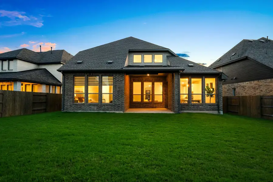 A meticulously maintained lawn frames this charming home, showcasing a thoughtful exterior design.