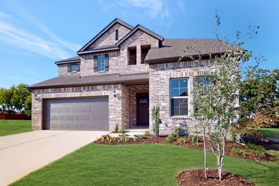 Front exterior of a new home in Vintage Village, Argyle, TX, highlighting curb appeal (Image 2).