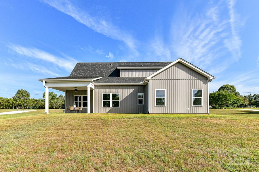 Exterior Back of Home with covered patio!