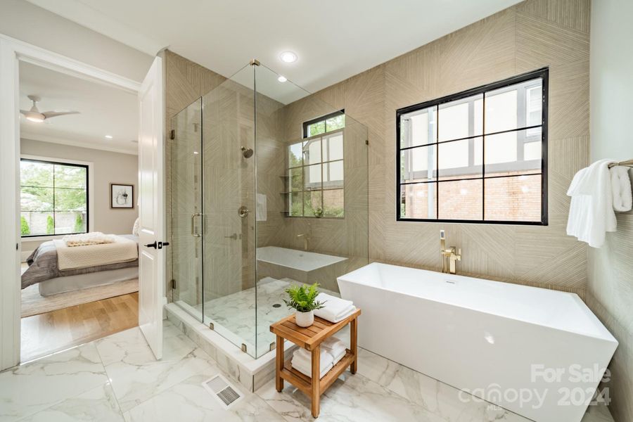 Main level Primary bath with elegant design