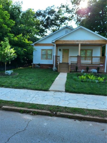 Front exterior of a new home in , Atlanta, GA, highlighting curb appeal (Image 13).